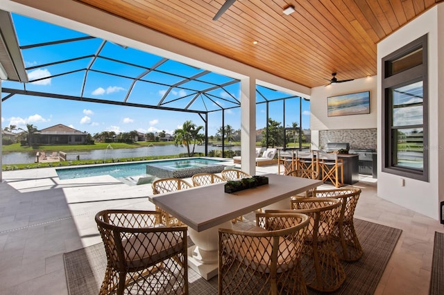 11611 Roseto Ct, Fort Myers, FL 33913 - view of patio featuring a ceiling fan, area for grilling, glass enclosure, a water view, and a pool with connected hot tub