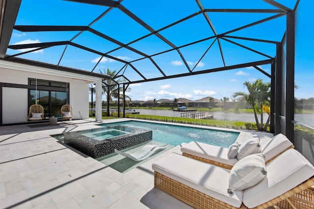 11611 Roseto Ct, Fort Myers, FL 33913 - view of pool featuring a patio, a lanai, a pool with connected hot tub, an outdoor living space, and a water view