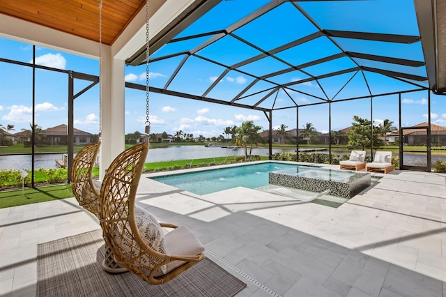 11611 Roseto Ct, Fort Myers, FL 33913 - view of pool with a patio area, a pool with connected hot tub, glass enclosure, and a water view