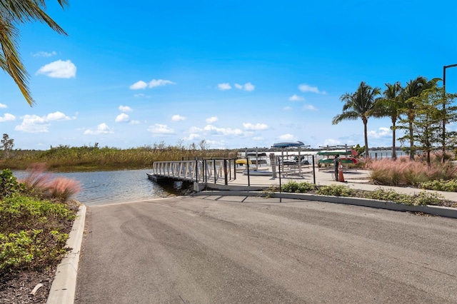 11611 Roseto Ct, Fort Myers, FL 33913 - dock area featuring a boat ramp and a water view