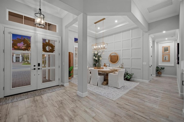11611 Roseto Ct, Fort Myers, FL 33913 - entrance foyer featuring wood finished floors, baseboards, a chandelier, french doors, and ornamental molding