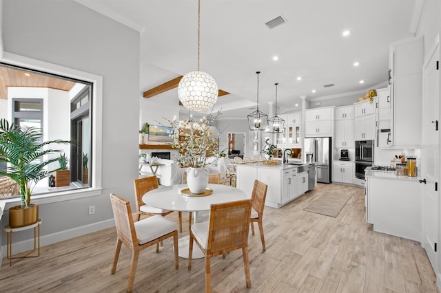 11611 Roseto Ct, Fort Myers, FL 33913 - dining area with ornamental molding, light wood-style flooring, recessed lighting, a chandelier, and baseboards