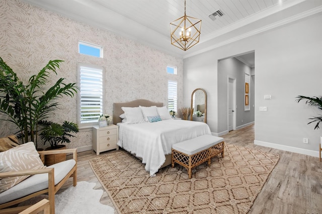 11611 Roseto Ct, Fort Myers, FL 33913 - bedroom with baseboards, a chandelier, light wood-type flooring, ornamental molding, and wallpapered walls