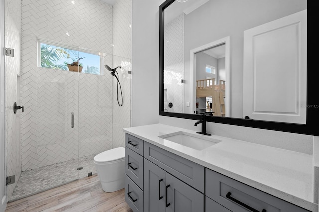 11611 Roseto Ct, Fort Myers, FL 33913 - full bath with vanity, a shower stall, toilet, and wood finished floors