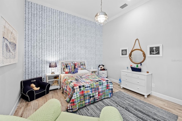 11611 Roseto Ct, Fort Myers, FL 33913 - bedroom featuring baseboards, wood finished floors, and an accent wall
