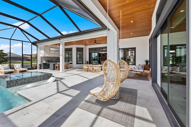 11611 Roseto Ct, Fort Myers, FL 33913 - sunroom featuring an outdoor hangout area, a ceiling fan, a hot tub, and area for grilling