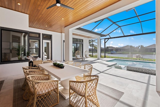 11611 Roseto Ct, Fort Myers, FL 33913 - view of patio with a ceiling fan, outdoor dining area, an outdoor pool, and a lanai
