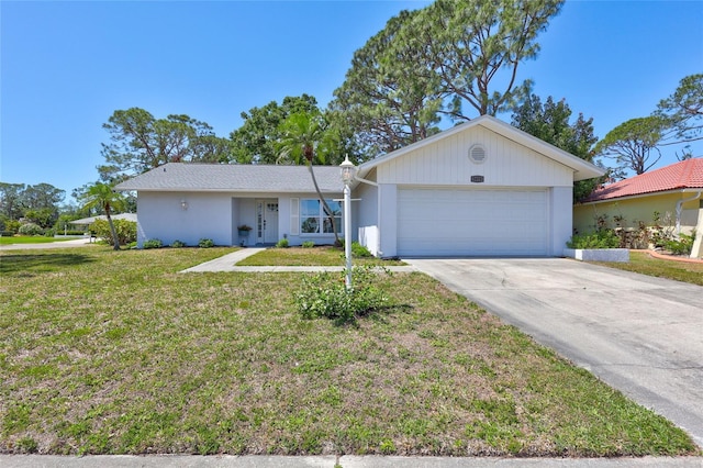 3978 Lemonwood Dr, Sarasota, FL 34232 - single story home with an attached garage, driveway, stucco siding, and a front lawn