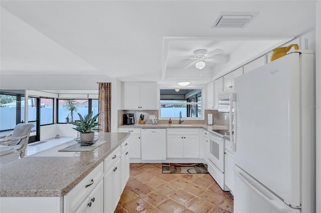 3978 Lemonwood Dr, Sarasota, FL 34232 - kitchen featuring white appliances, a ceiling fan, visible vents, a sink, and backsplash