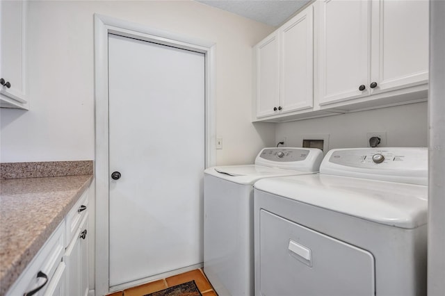 3978 Lemonwood Dr, Sarasota, FL 34232 - washroom with washer and dryer, tile patterned floors, and cabinet space