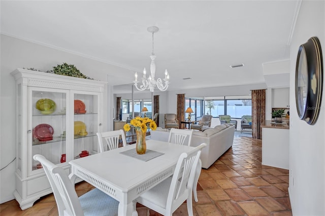 3978 Lemonwood Dr, Sarasota, FL 34232 - dining room featuring a chandelier, visible vents, and crown molding