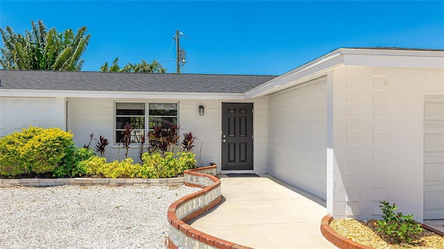 6628 Keystone Dr, Sarasota, FL 34231 - entrance to property featuring roof with shingles