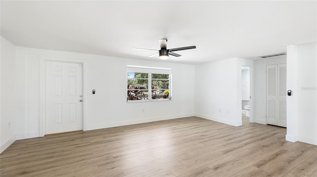 6628 Keystone Dr, Sarasota, FL 34231 - unfurnished living room featuring ceiling fan, light wood finished floors, and baseboards