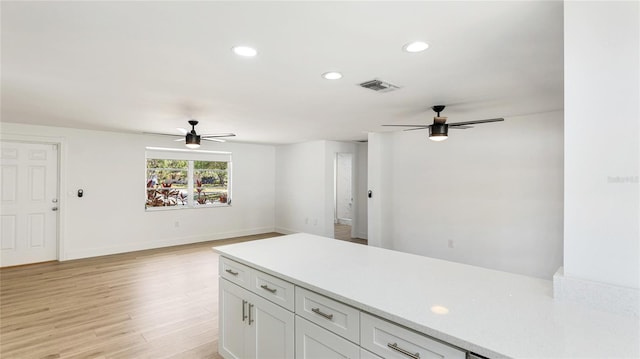 6628 Keystone Dr, Sarasota, FL 34231 - kitchen with ceiling fan, light countertops, light wood-type flooring, recessed lighting, and baseboards