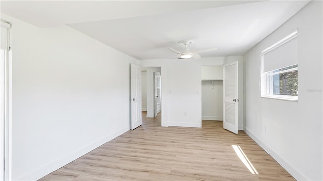 6628 Keystone Dr, Sarasota, FL 34231 - unfurnished bedroom featuring light wood-style floors, baseboards, a closet, and ceiling fan