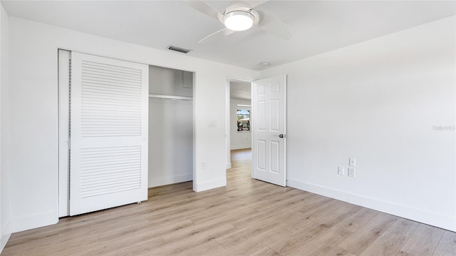 6628 Keystone Dr, Sarasota, FL 34231 - unfurnished bedroom with a closet, light wood finished floors, baseboards, and a ceiling fan
