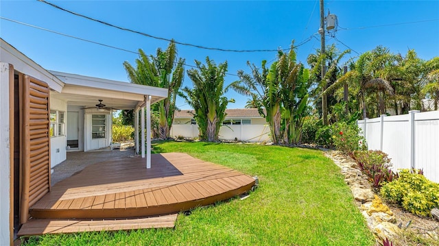 6628 Keystone Dr, Sarasota, FL 34231 - view of yard featuring ceiling fan and a deck