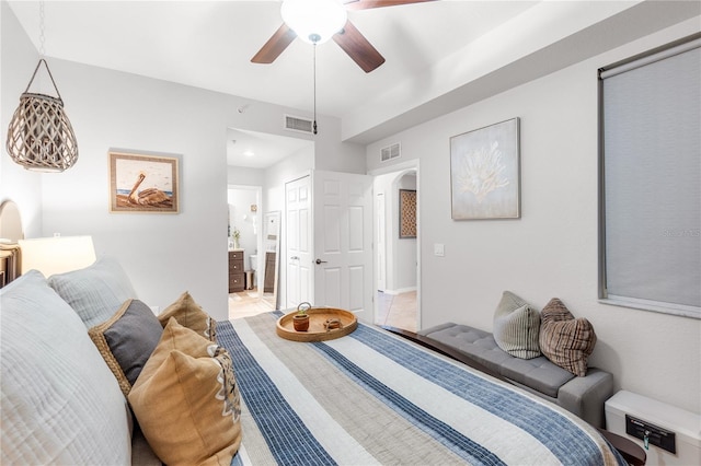 7803 Grand Estuary Trl Unit 102, Bradenton, FL 34212 - bedroom with arched walkways, a ceiling fan, visible vents, and connected bathroom