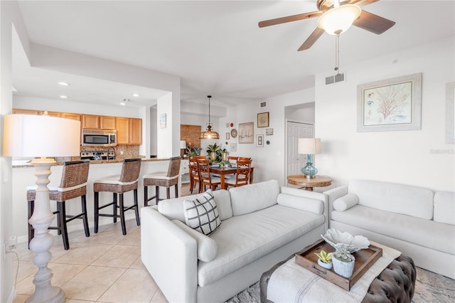 7803 Grand Estuary Trl Unit 102, Bradenton, FL 34212 - living area with light tile patterned floors, a ceiling fan, visible vents, and recessed lighting