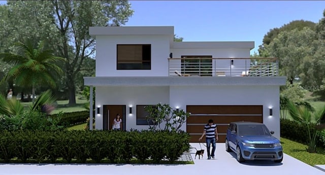 1423 S Shade Ave, Sarasota, FL 34239 - contemporary home with concrete driveway, a garage, stucco siding, and a balcony