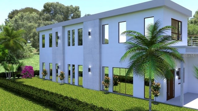 1423 S Shade Ave, Sarasota, FL 34239 - rear view of property with stucco siding and a yard