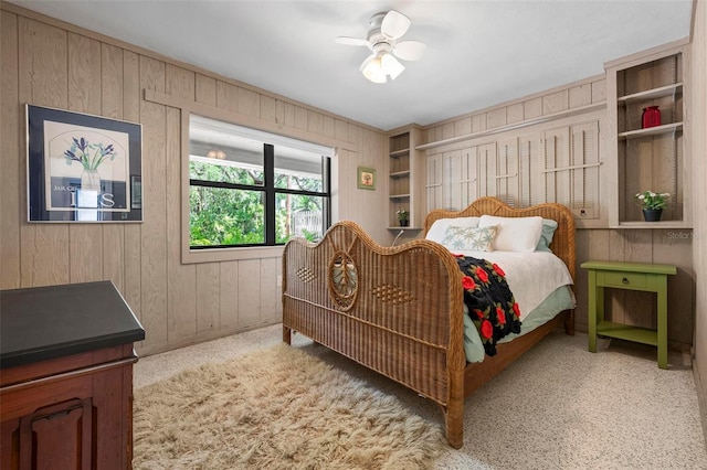 bedroom with wood walls