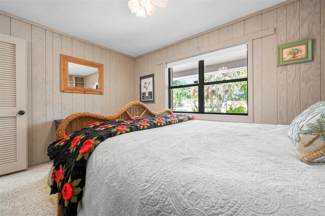bedroom with wooden walls