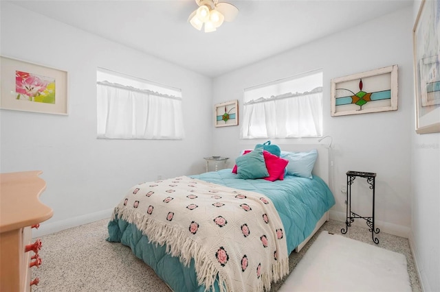 carpeted bedroom featuring baseboards