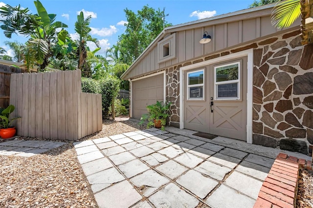 view of outbuilding featuring fence