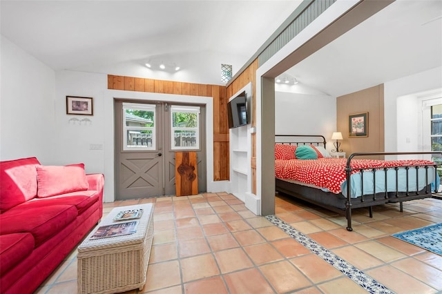 tiled bedroom with vaulted ceiling