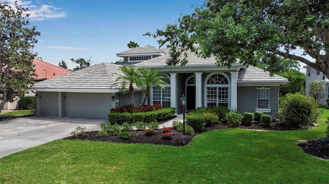 3738 Eagle Hammock Dr, Sarasota, FL 34240 - view of front of house featuring a tile roof, a front yard, and a garage
