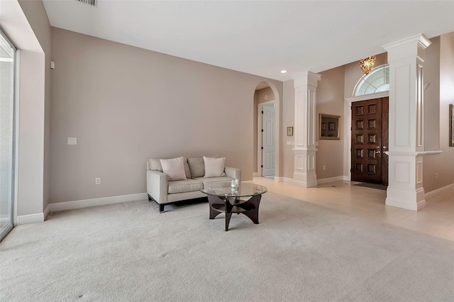 3738 Eagle Hammock Dr, Sarasota, FL 34240 - living area featuring light carpet, arched walkways, decorative columns, baseboards, and recessed lighting
