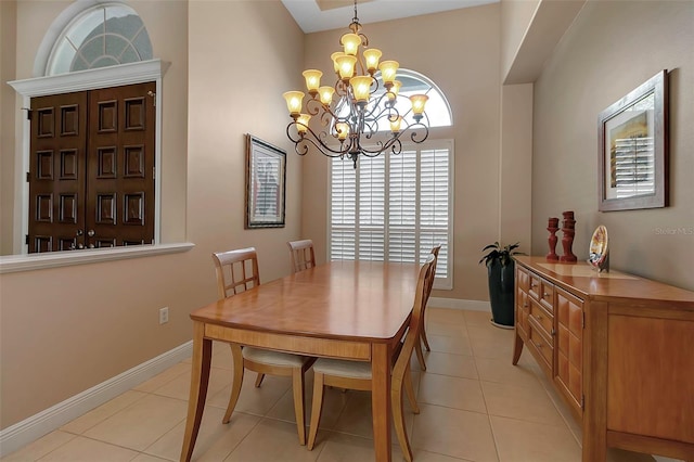 3738 Eagle Hammock Dr, Sarasota, FL 34240 - dining area with baseboards, a notable chandelier, and light tile patterned flooring