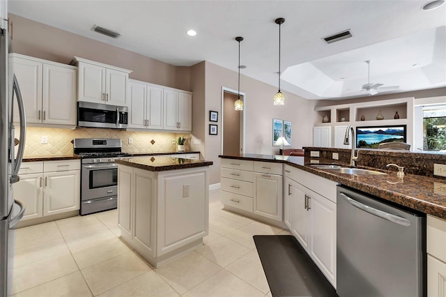 3738 Eagle Hammock Dr, Sarasota, FL 34240 - kitchen featuring a sink, visible vents, backsplash, ceiling fan, and appliances with stainless steel finishes