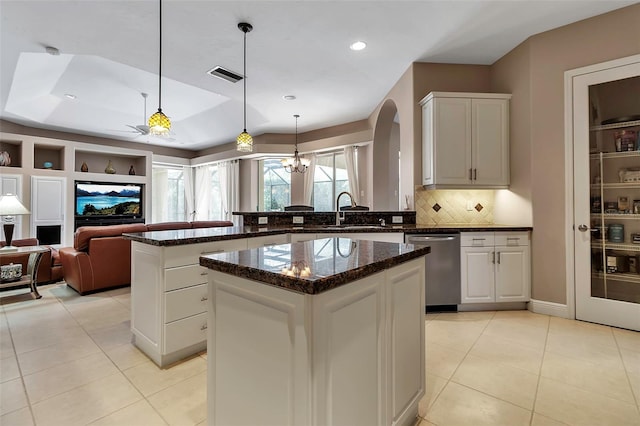 3738 Eagle Hammock Dr, Sarasota, FL 34240 - kitchen with a peninsula, stainless steel dishwasher, a sink, light tile patterned flooring, and visible vents