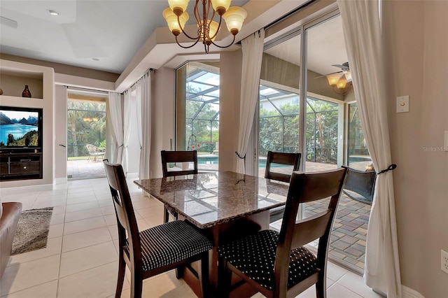 3738 Eagle Hammock Dr, Sarasota, FL 34240 - dining space featuring plenty of natural light, a sunroom, a chandelier, and light tile patterned floors