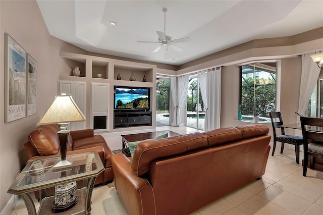 3738 Eagle Hammock Dr, Sarasota, FL 34240 - living room featuring a raised ceiling, ceiling fan, and light tile patterned flooring