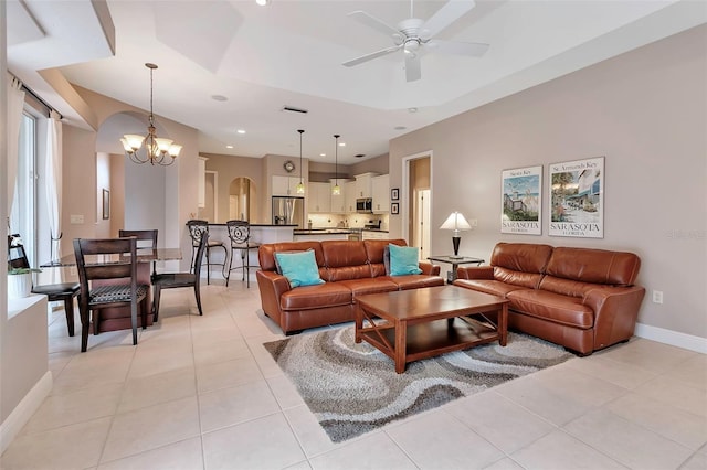 3738 Eagle Hammock Dr, Sarasota, FL 34240 - living area with arched walkways, baseboards, recessed lighting, ceiling fan with notable chandelier, and light tile patterned floors