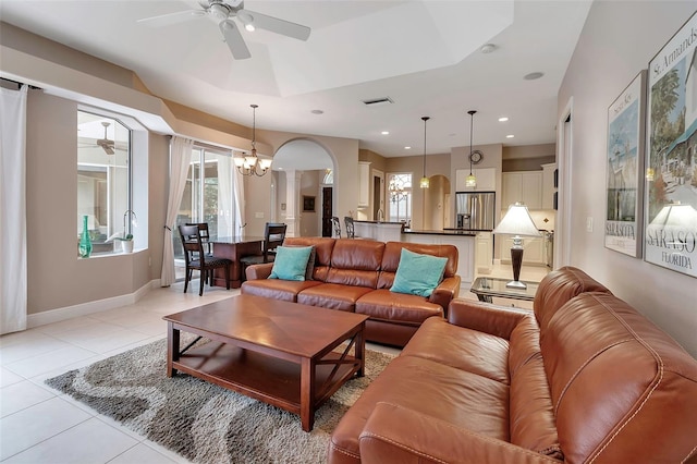 3738 Eagle Hammock Dr, Sarasota, FL 34240 - living area with baseboards, visible vents, light tile patterned floors, and ceiling fan with notable chandelier