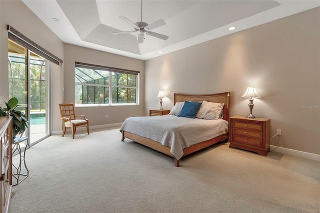 3738 Eagle Hammock Dr, Sarasota, FL 34240 - bedroom featuring a raised ceiling, light carpet, baseboards, and access to outside