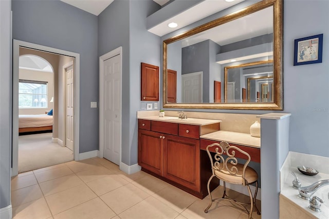 3738 Eagle Hammock Dr, Sarasota, FL 34240 - bathroom with tile patterned floors, vanity, connected bathroom, a bath, and baseboards