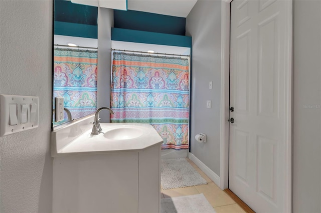 3738 Eagle Hammock Dr, Sarasota, FL 34240 - full bathroom featuring a textured wall, tile patterned flooring, and vanity