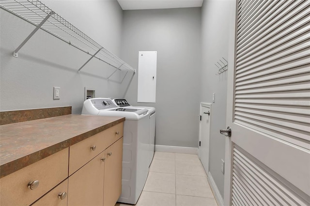 3738 Eagle Hammock Dr, Sarasota, FL 34240 - laundry room with light tile patterned flooring, washer and clothes dryer, baseboards, and laundry area