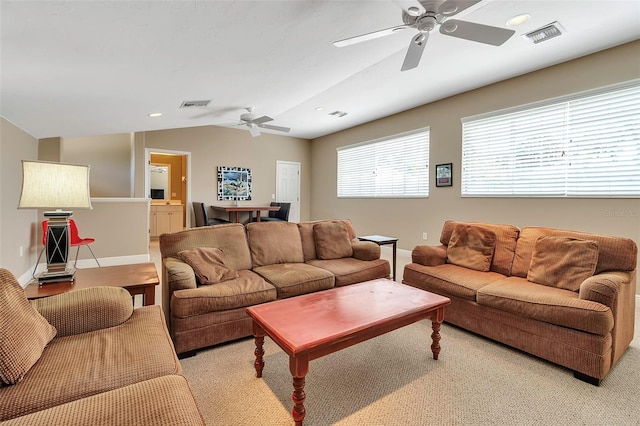 3738 Eagle Hammock Dr, Sarasota, FL 34240 - living room featuring light carpet, vaulted ceiling, visible vents, and ceiling fan