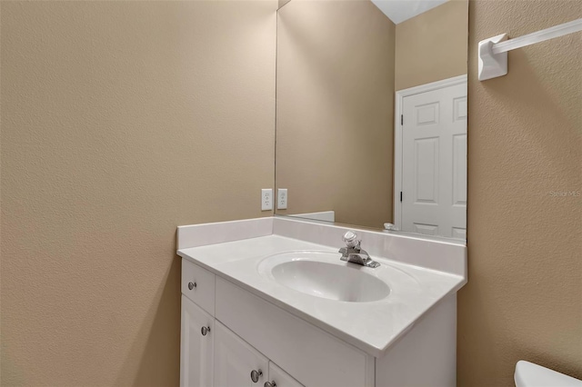 3738 Eagle Hammock Dr, Sarasota, FL 34240 - bathroom with a textured wall, vanity, and toilet
