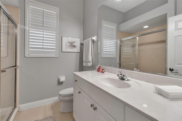 3738 Eagle Hammock Dr, Sarasota, FL 34240 - bathroom with a shower stall, tile patterned flooring, toilet, vanity, and baseboards
