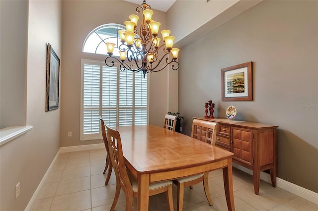 3738 Eagle Hammock Dr, Sarasota, FL 34240 - dining area featuring baseboards, an inviting chandelier, and light tile patterned floors