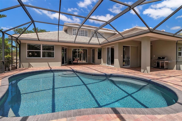 3738 Eagle Hammock Dr, Sarasota, FL 34240 - back of property with a patio, an outdoor pool, a tile roof, and stucco siding