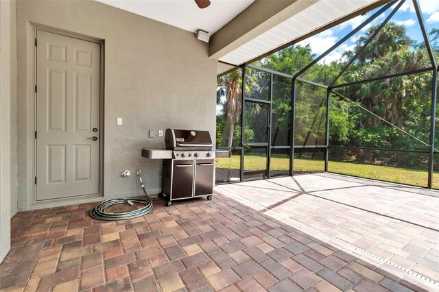 3738 Eagle Hammock Dr, Sarasota, FL 34240 - view of patio / terrace featuring a ceiling fan, glass enclosure, and area for grilling