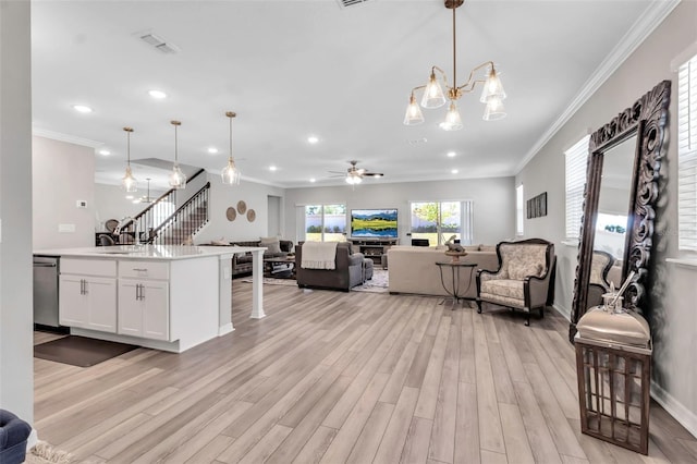living area with visible vents, ornamental molding, light wood-style flooring, and recessed lighting